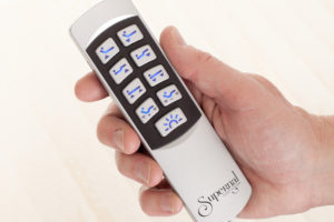 Illuminated wireless hand control for Supernal beds